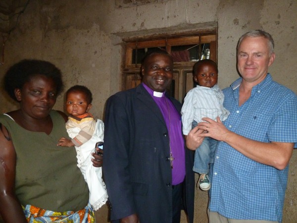 Baby Peter Isesomo between Bishop Isesomo and Peter Pearson