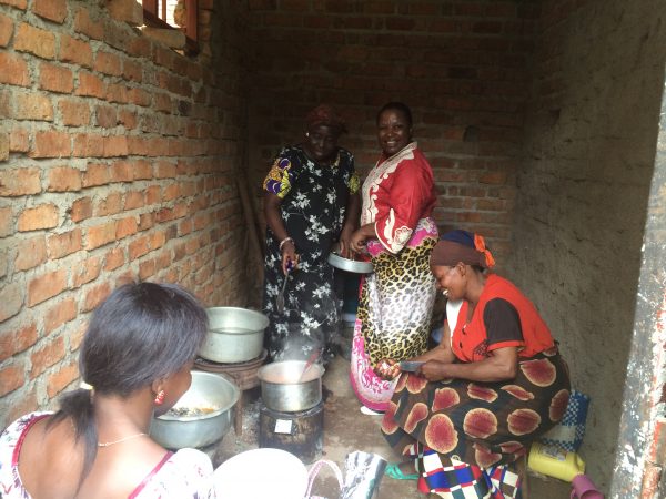 Staff of St Matthieu prepare a meal in the room of the operating block that will house the electrics